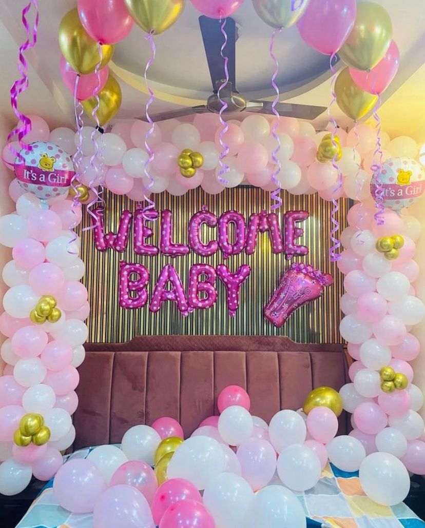 pink and white welcome baby decor